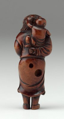 Alternate image of Netsuke in the form of a curly-haired Dutchman carrying a child on his back, holding a horn by 