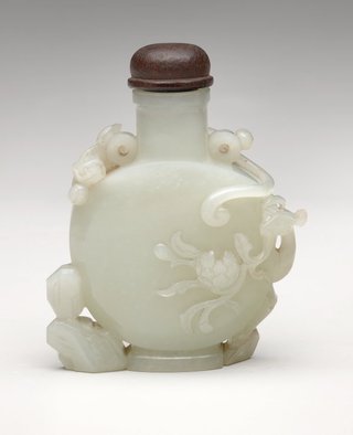 AGNSW collection Bottle with carved ornament with rocks, peacock and peony 19th century