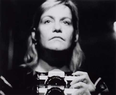Alternate image of Self-portrait with camera (1960-2006) by Sue Ford