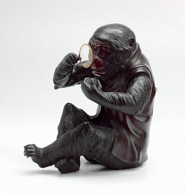 Alternate image of Monkey wearing a waistcoat and using an eyeglass to examine a peach by Meiji export ware