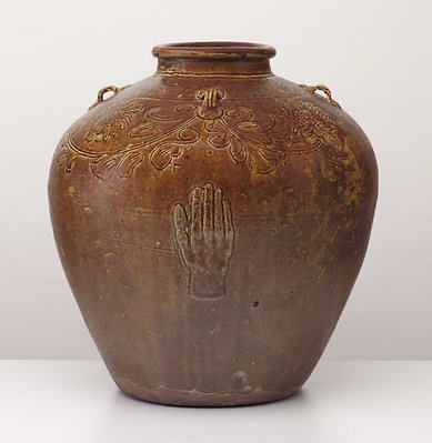 Alternate image of Globular jar decorated with relief 'head and hand' motif by 