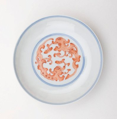 Alternate image of Small dish of saucer shape, the interior decorated with two monsters in overglaze iron red by Jingdezhen ware