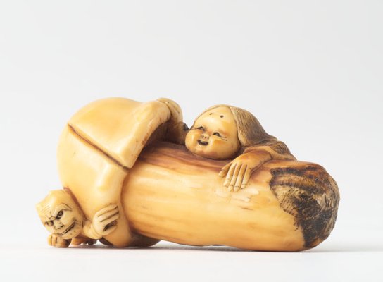 Alternate image of Netsuke in the form of a mushroom with 'okame' leaning against it and 'oni' crouching under it by 