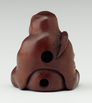Alternate image of Netsuke in the form of a seated Daruma, holding a fly whisk by 
