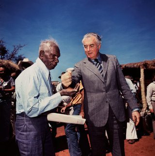 AGNSW collection Mervyn Bishop Prime Minister Gough Whitlam pours soil into the hands of traditional land owner Vincent Lingiari, Northern Territory 1975, printed 1999