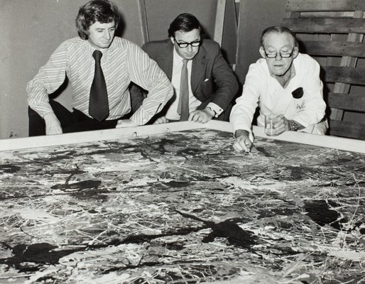 Alternate image of James Mollison and Peter Laverty watching conservator William Boustead examining ‘Blue Poles’ 1952 by Jackson Pollock by Unknown
