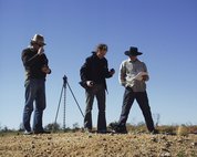 Laing and assistants in 2003 in the Tanami Desert, shooting the series *one dozen unnatural disasters in the Australian landscape*. Photo Peter Burgess